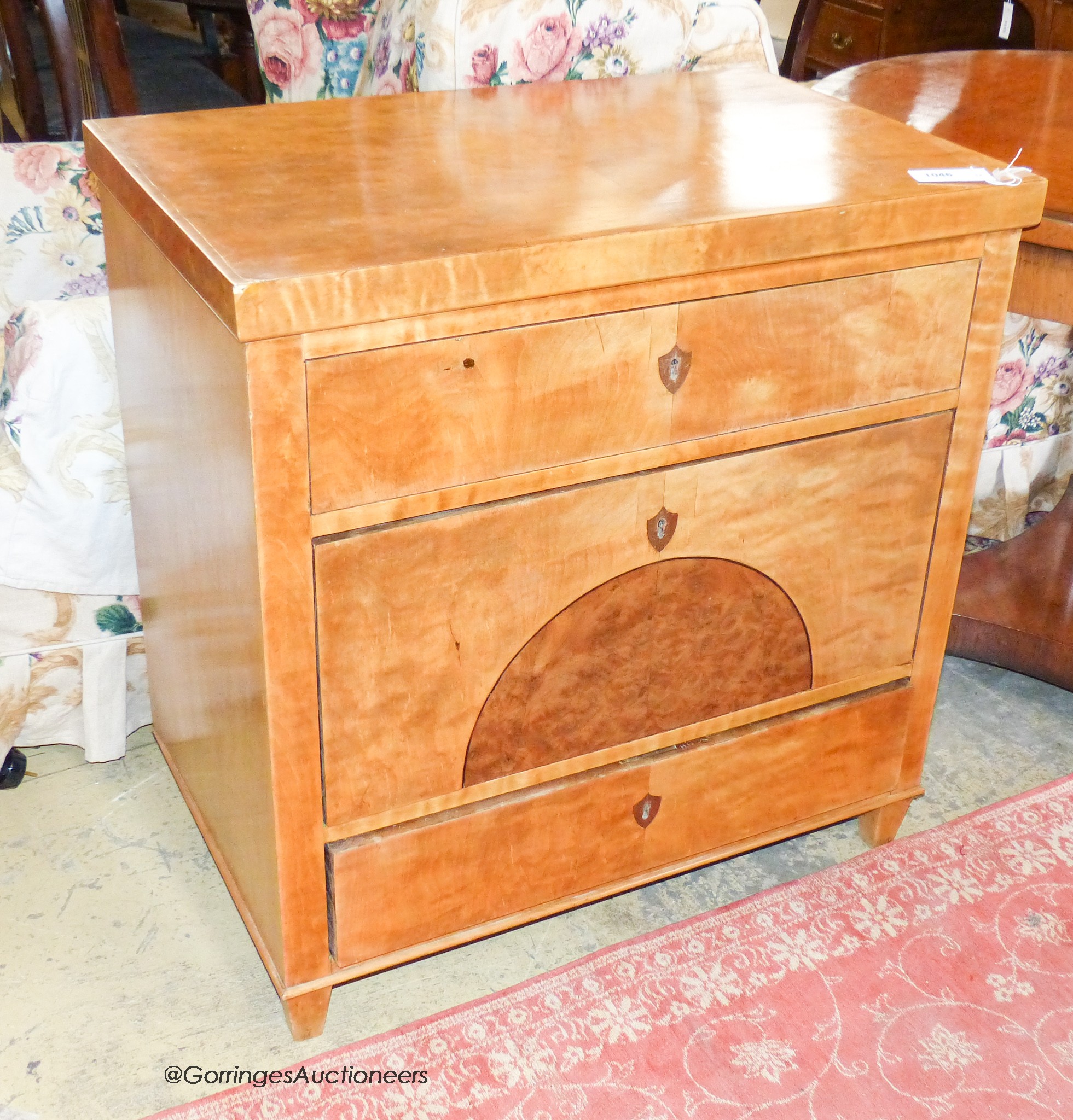 A Biedermier birch three drawer commode, W.75cm D.47cm H.77cm